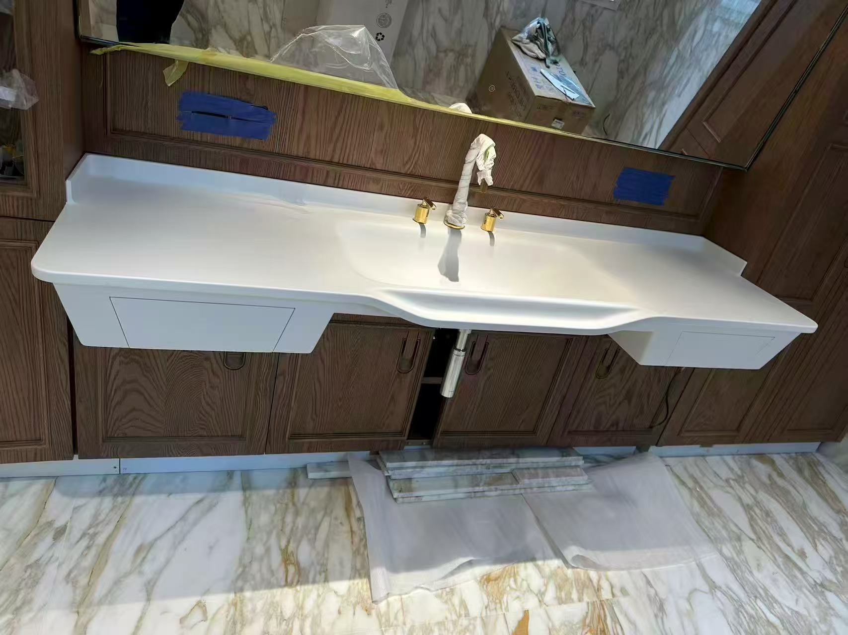Corian integrated basin with marble pattern for custom bathroom vanity in Singapore
