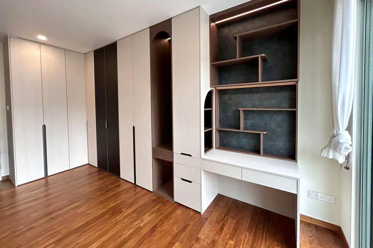 Completed CASAWAVE bedroom with a full-wall wardrobe run, built-in study desk and a lit display unit