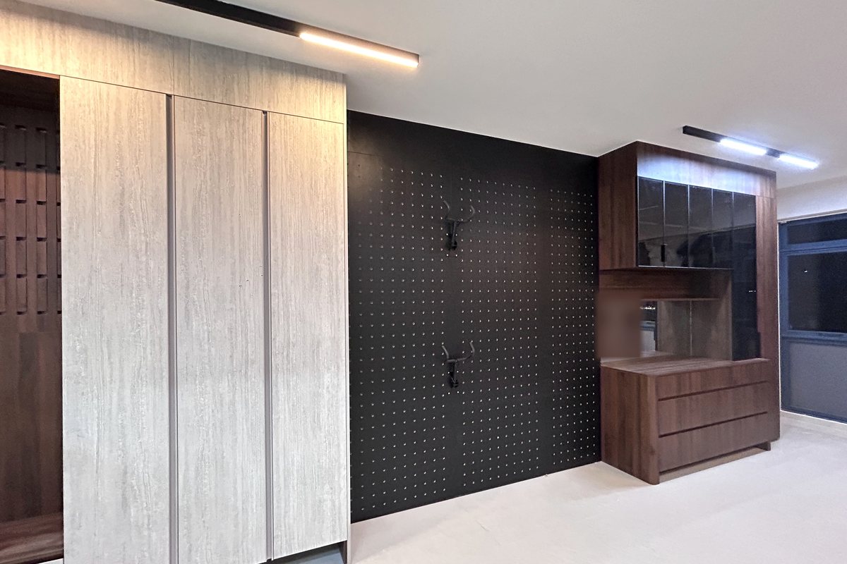 Completed CASAWAVE entrance with a stone-look full-height storage wall, black perforated feature panel and walnut display cabinet