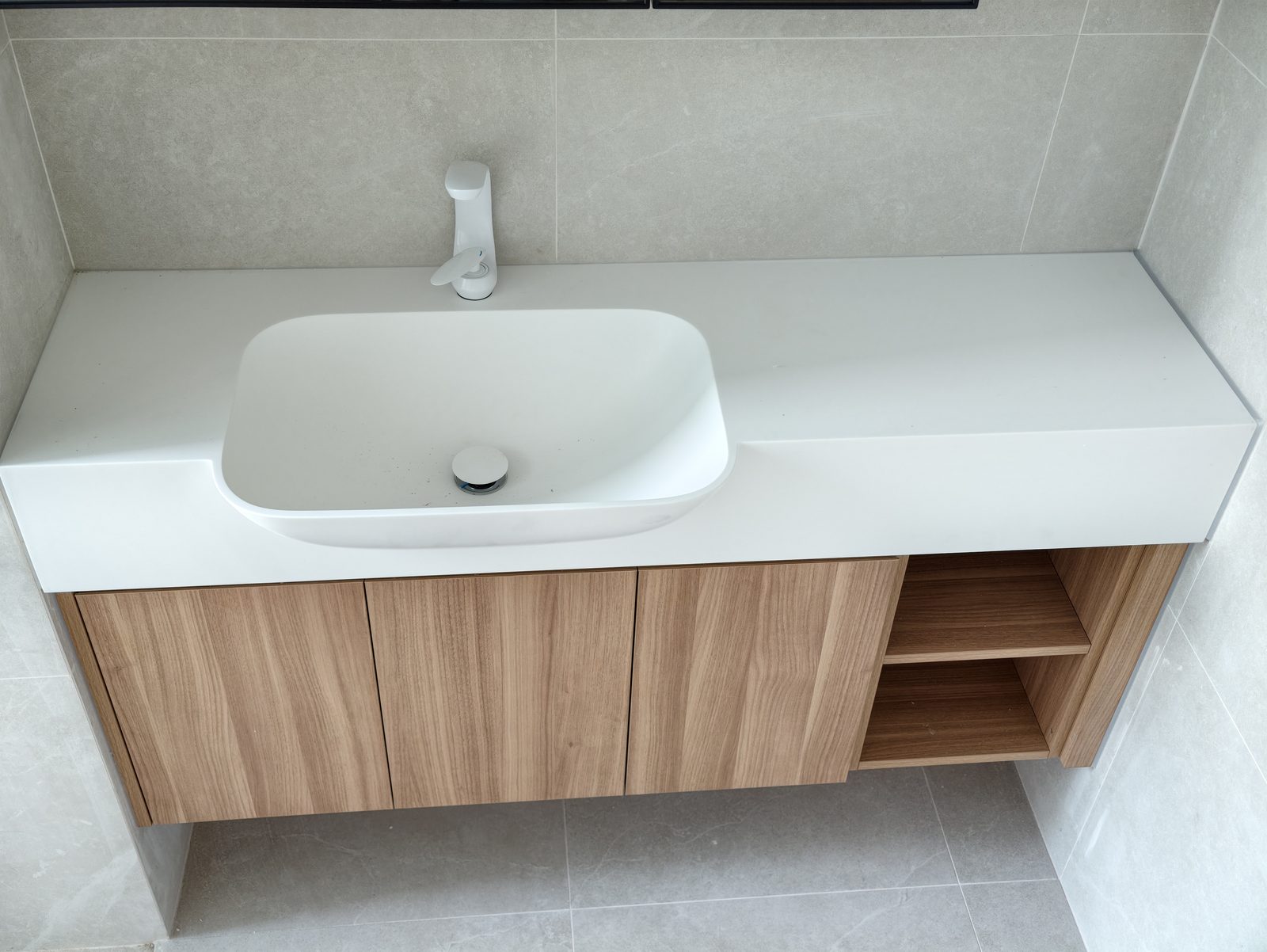 CASAWAVE custom Corian integrated basin bathroom vanity installed in a Singapore home