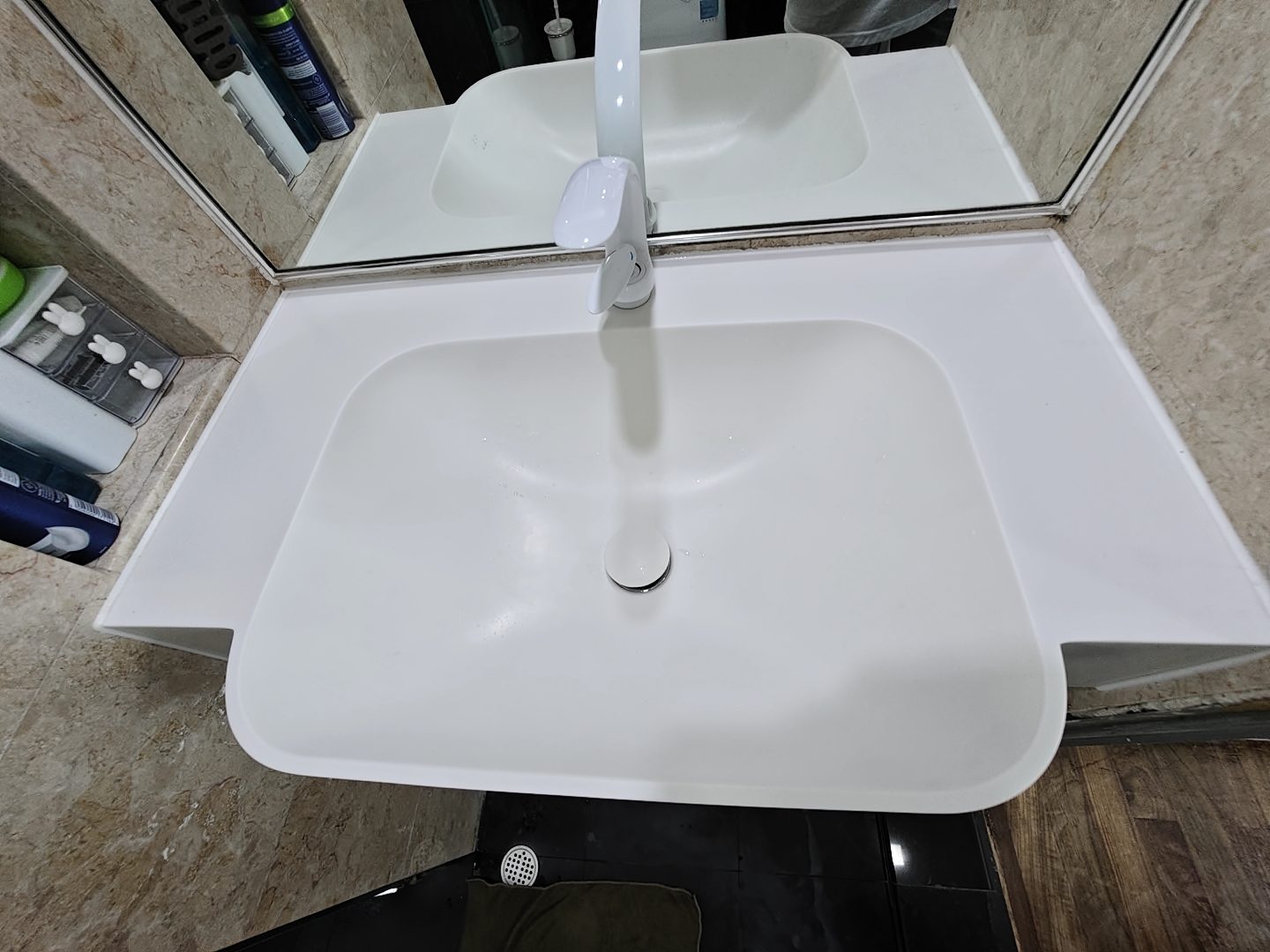 CASAWAVE completed custom bathroom vanity with Corian integrated basin and storage in a renovated Singapore flat