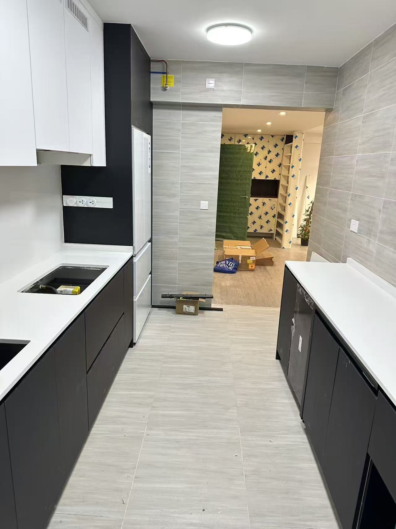 Renovated custom kitchen cabinets with sintered stone countertop by CASAWAVE Singapore